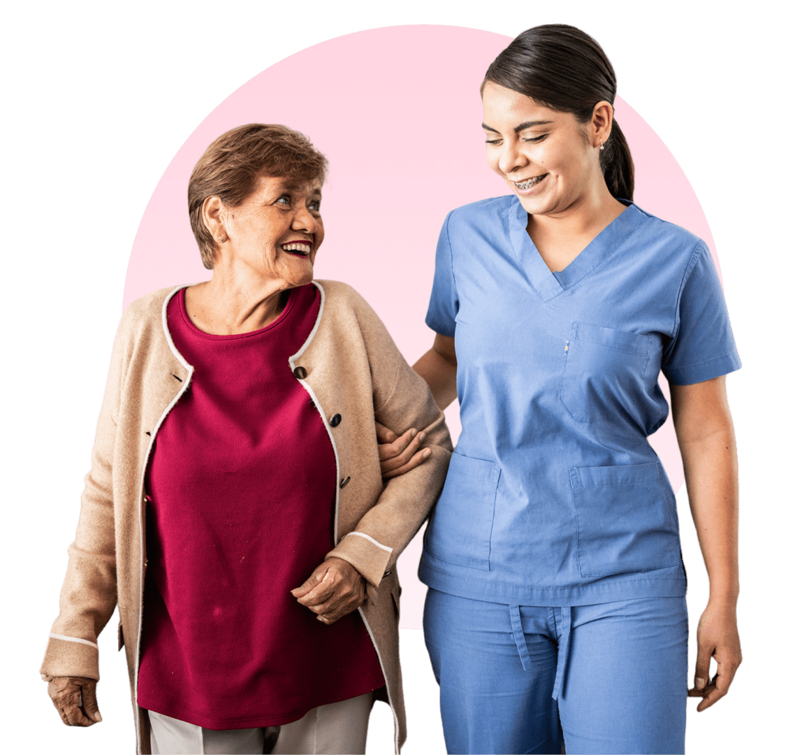 Elderly woman and nurse smiling together.